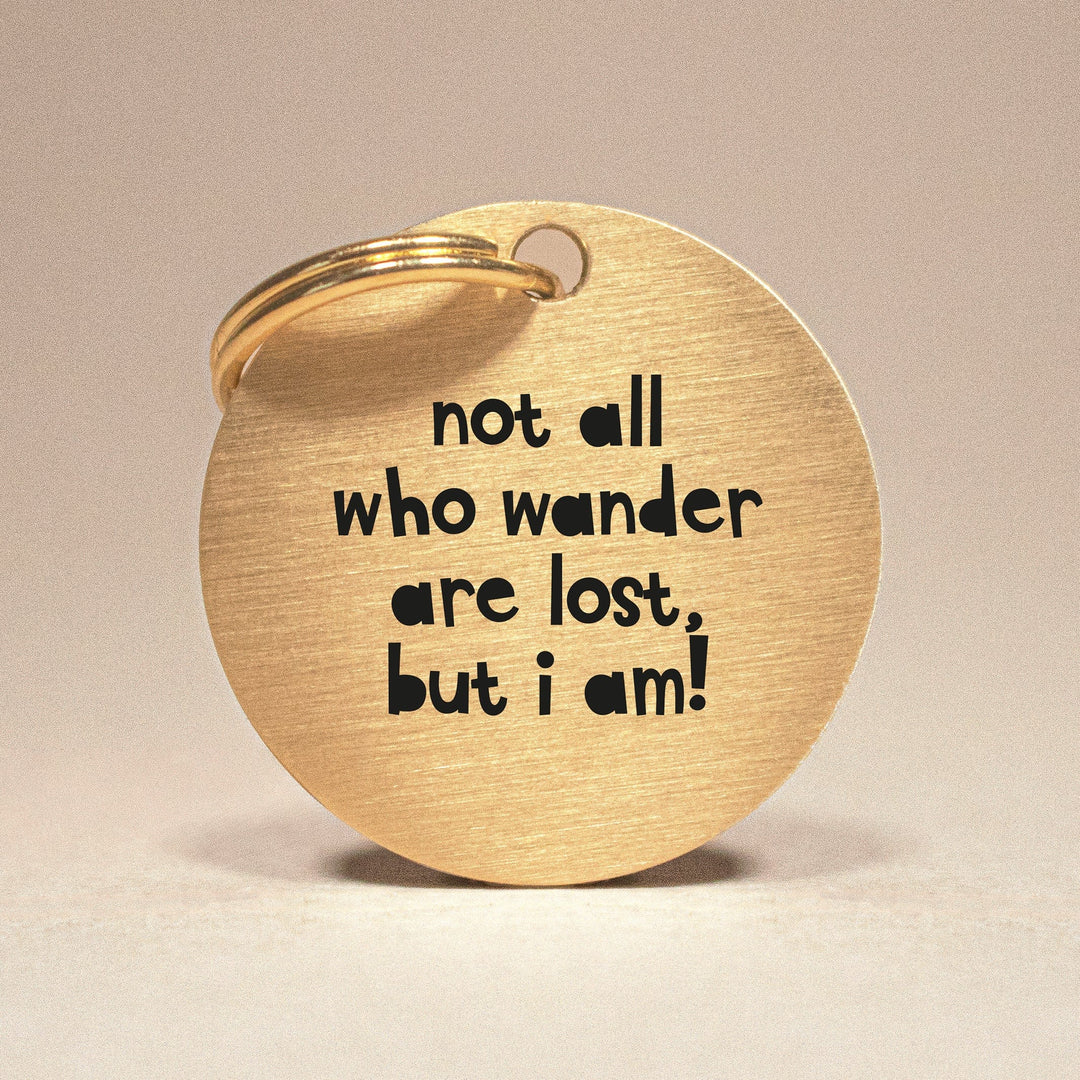 Personalised Gold Brass Dog ID Tag, inscribed with 'Not All Who Wander Are Lost, But I Am!
