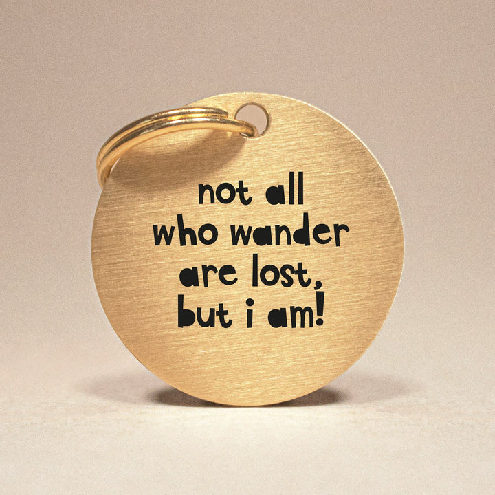 Personalised Gold Brass Dog ID Tag, inscribed with 'Not All Who Wander Are Lost, But I Am!