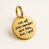 Personalised Gold Brass Dog ID Tag, inscribed with 'Not All Who Wander Are Lost, But I Am! The Stately Hound