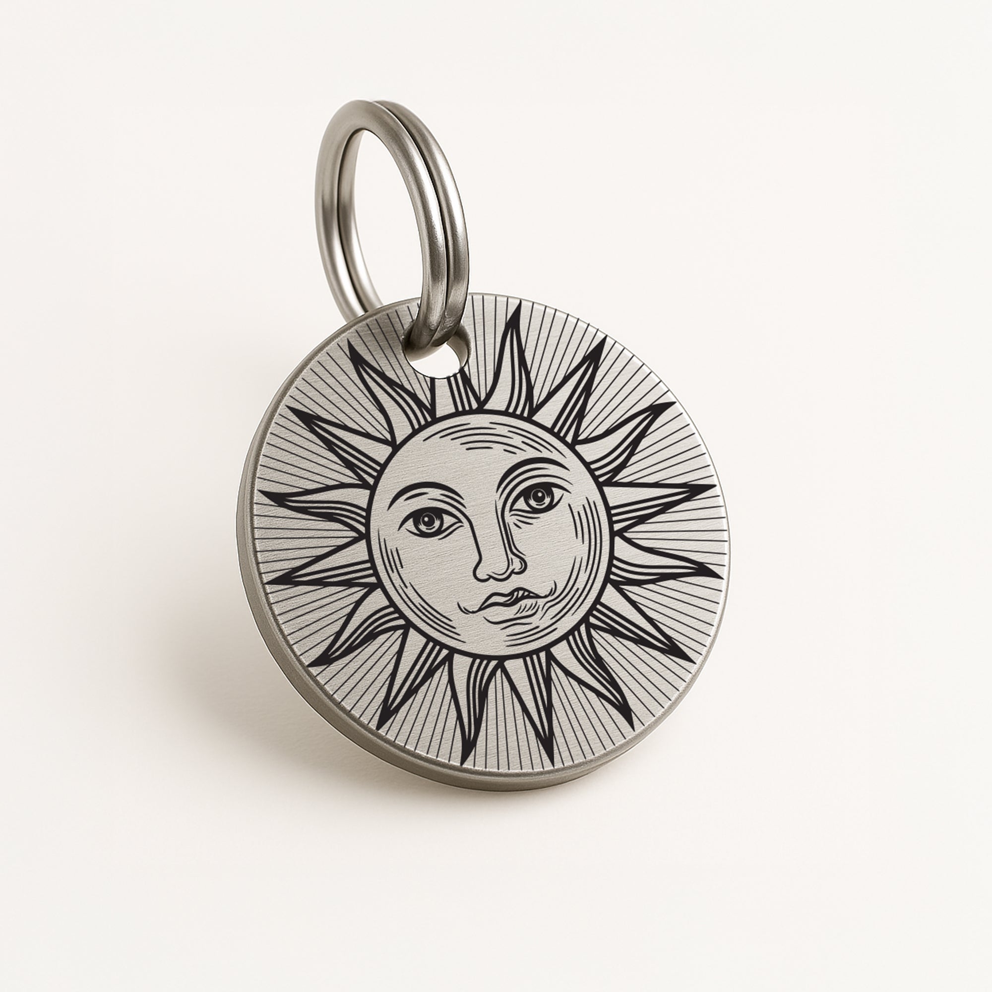 Personalised Silver Dog ID Tag with Engraved Sun Design and Contact Details The Stately Hound