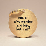 Personalised Gold Brass Dog ID Tag, inscribed with 'Not All Who Wander Are Lost, But I Am! The Stately Hound