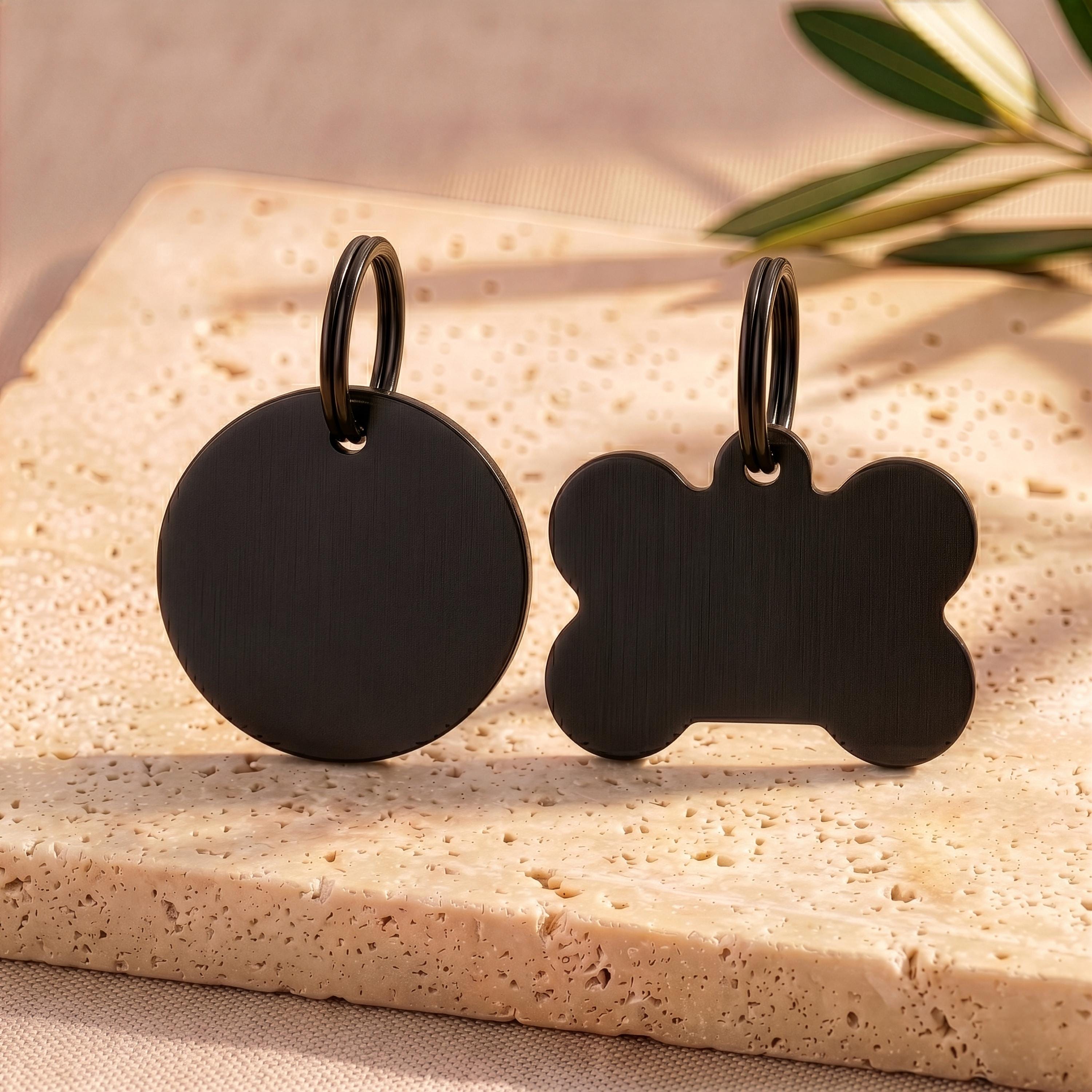 Black round and bone personalised dog tags in a brushed black finish