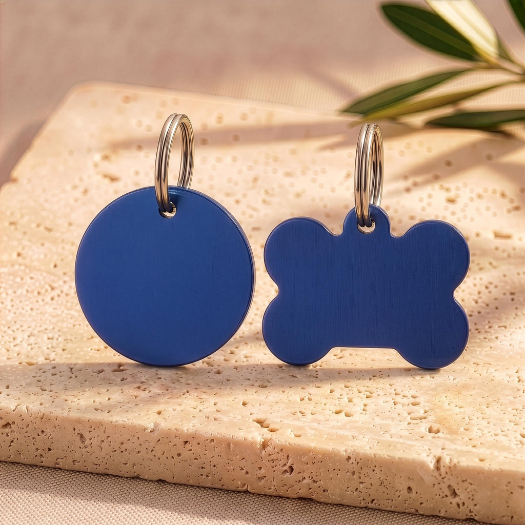 Blue round and bone personalised dog tags in brushed navy, ready for engraving