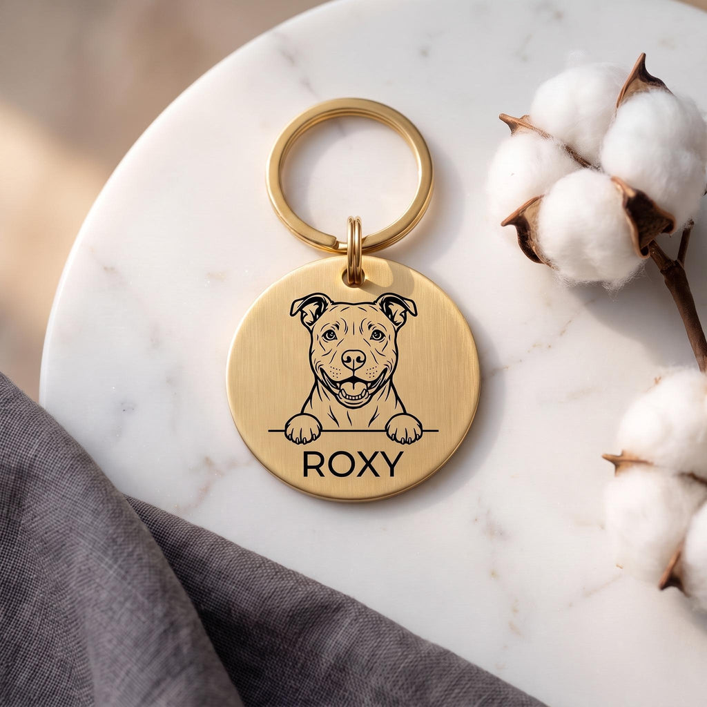 Gold Staffy dog tag engraved with the Staffy design and the name ROXY