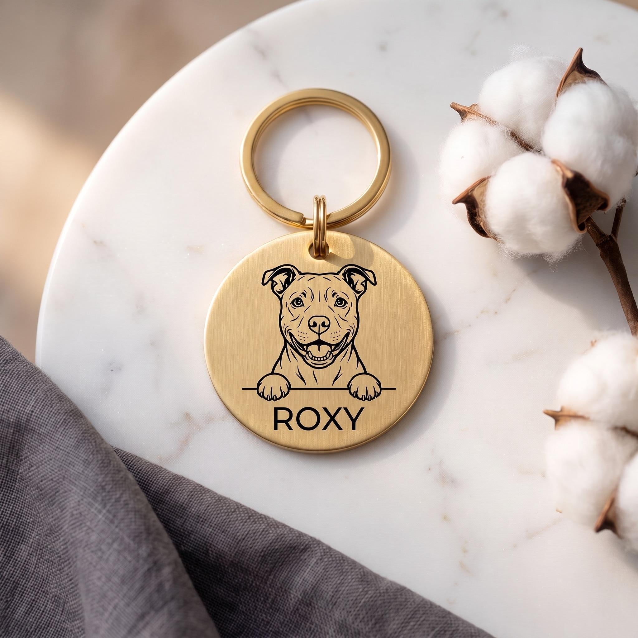 Gold Staffy dog tag engraved with the Staffy design and the name ROXY