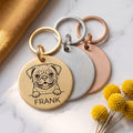 Personalised Pug dog tags in gold, silver and rose gold, fanned to show all three brushed finishes