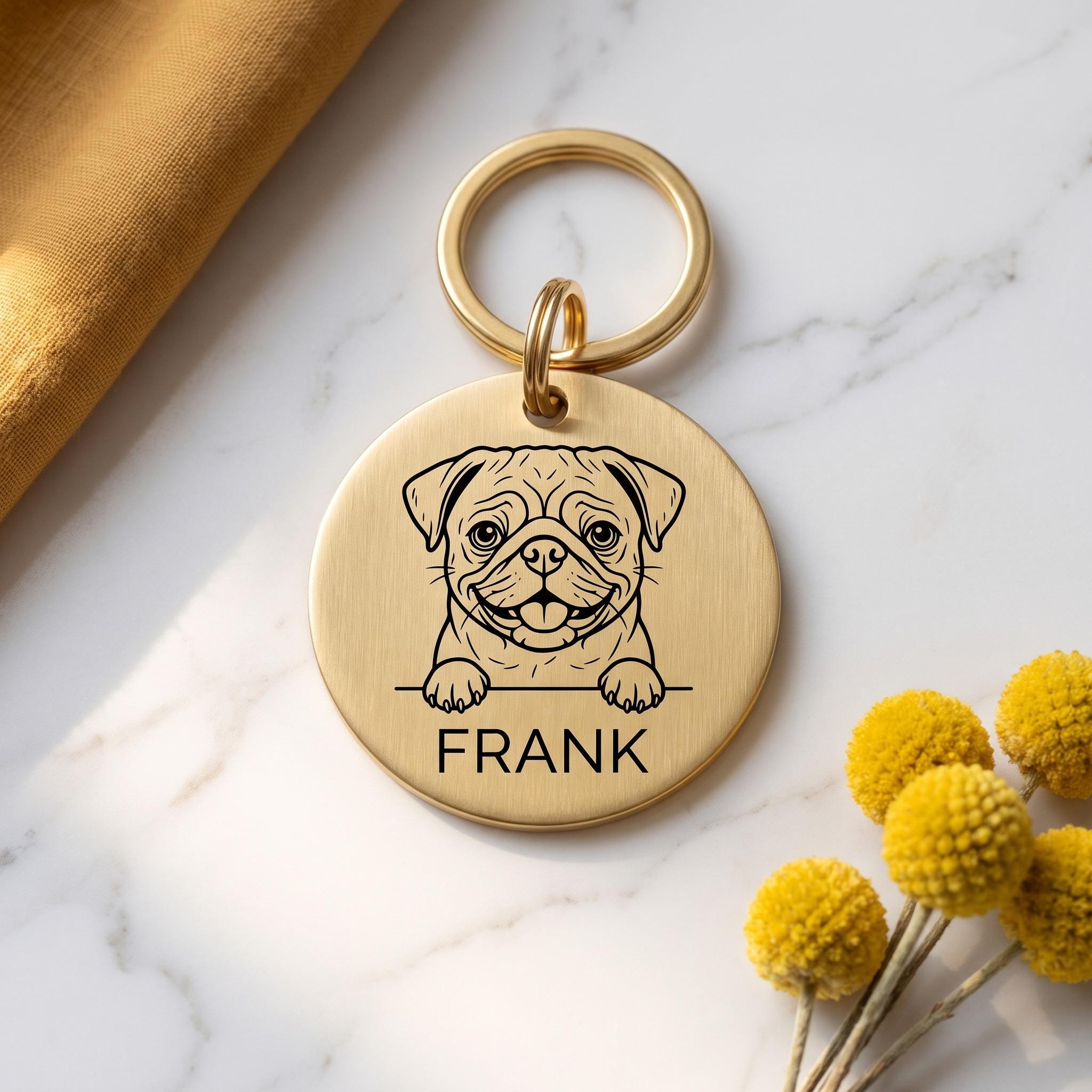 Gold Pug dog tag engraved with the Pug design and the name FRANK