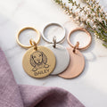 Personalised Springer Spaniel dog tags in gold, silver and rose gold, fanned to show all three brushed finishes