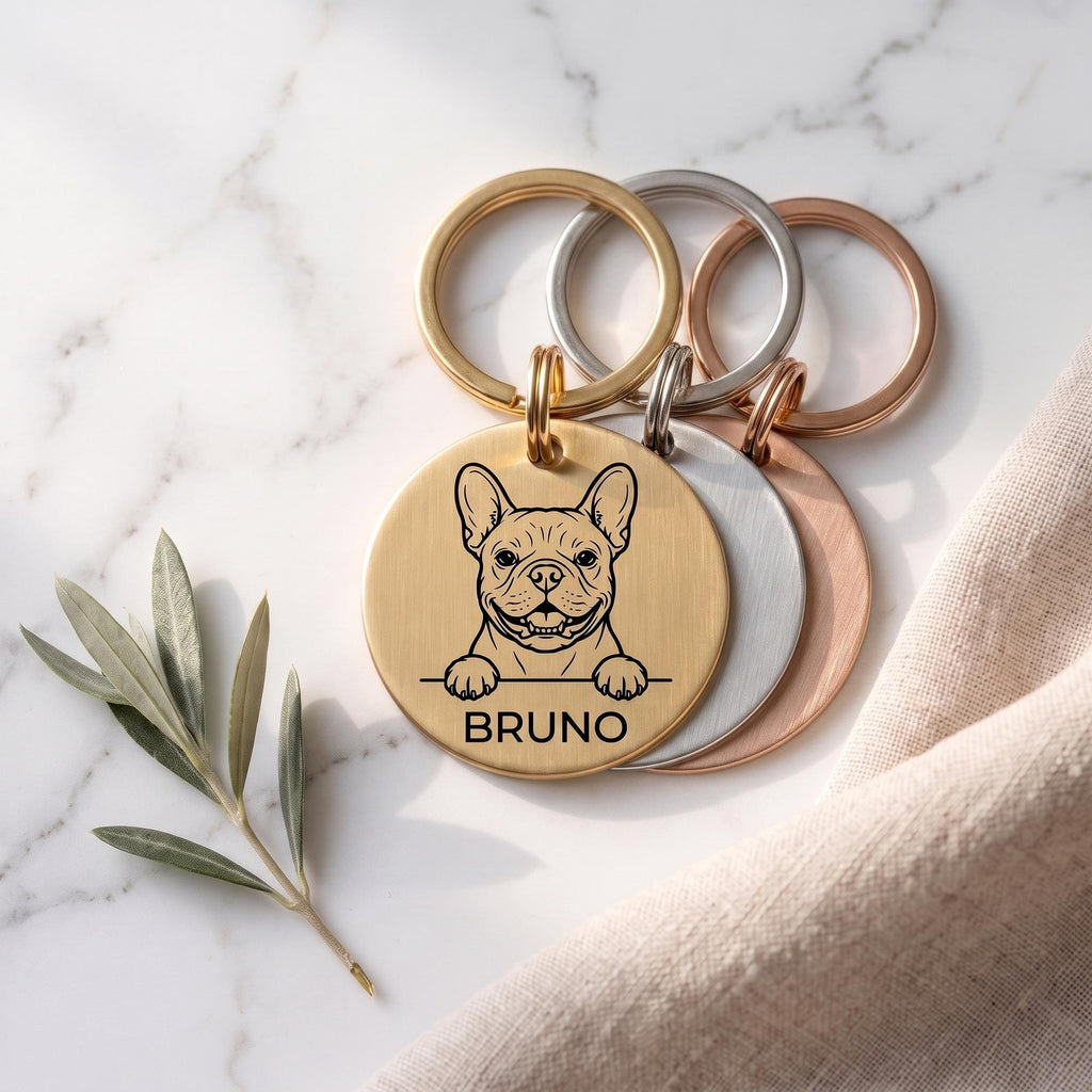 Personalised French Bulldog dog tags in gold, silver and rose gold, fanned to show all three brushed finishes