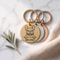 Personalised French Bulldog dog tags in gold, silver and rose gold, fanned to show all three brushed finishes