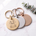 Personalised Dachshund dog tags in gold, silver and rose gold, fanned to show all three brushed finishes
