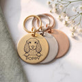 Personalised Cocker Spaniel dog tags in gold, silver and rose gold, fanned to show all three brushed finishes