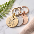 Personalised Labrador dog tags in gold, silver and rose gold, fanned to show all three brushed finishes