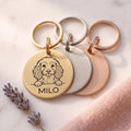 Personalised Cockapoo dog tags in gold, silver and rose gold, fanned to show all three brushed finishes