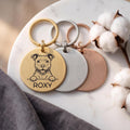 Personalised Staffy dog tags in gold, silver and rose gold, fanned to show all three brushed finishes
