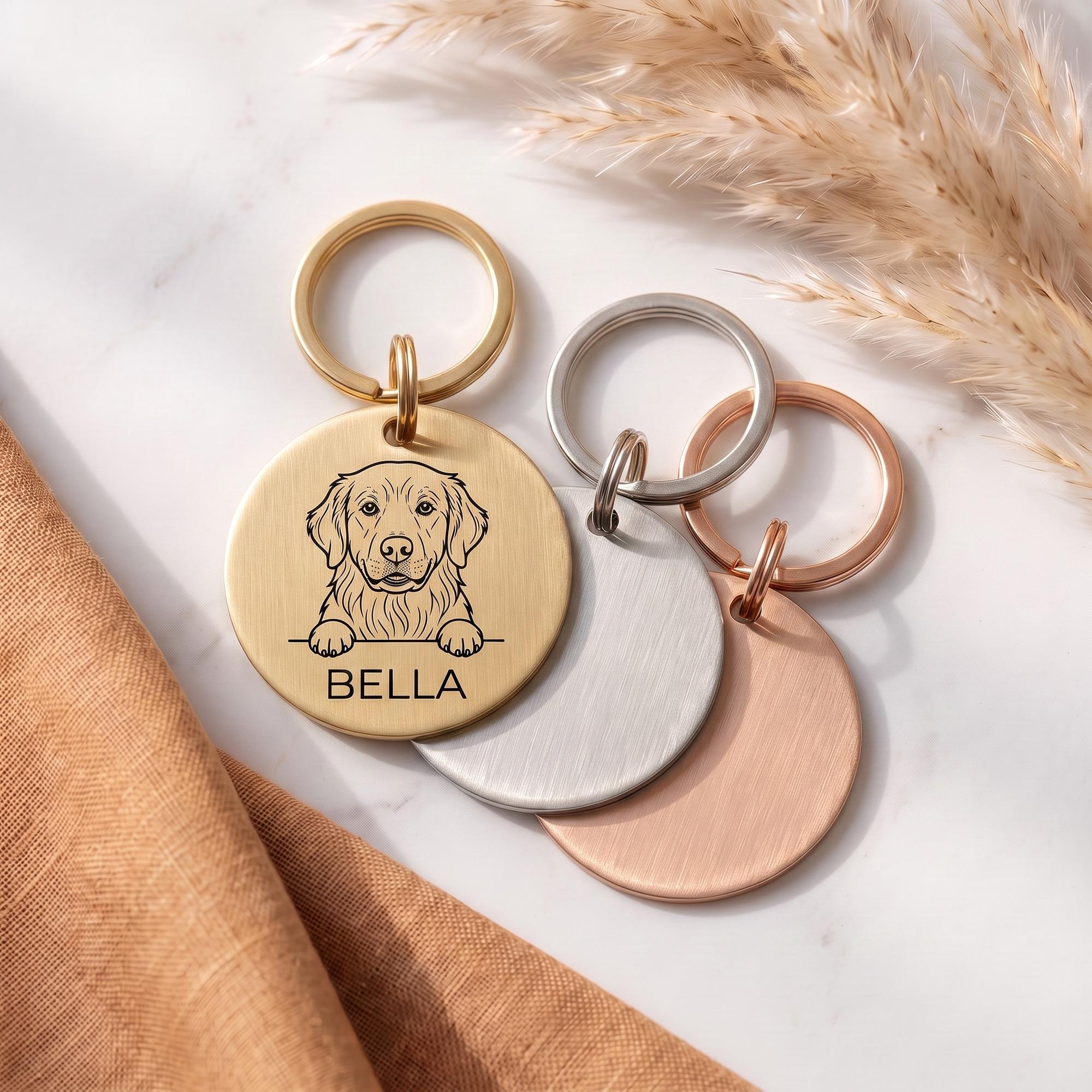 Personalised Golden Retriever dog tags in gold, silver and rose gold, fanned to show all three brushed finishes
