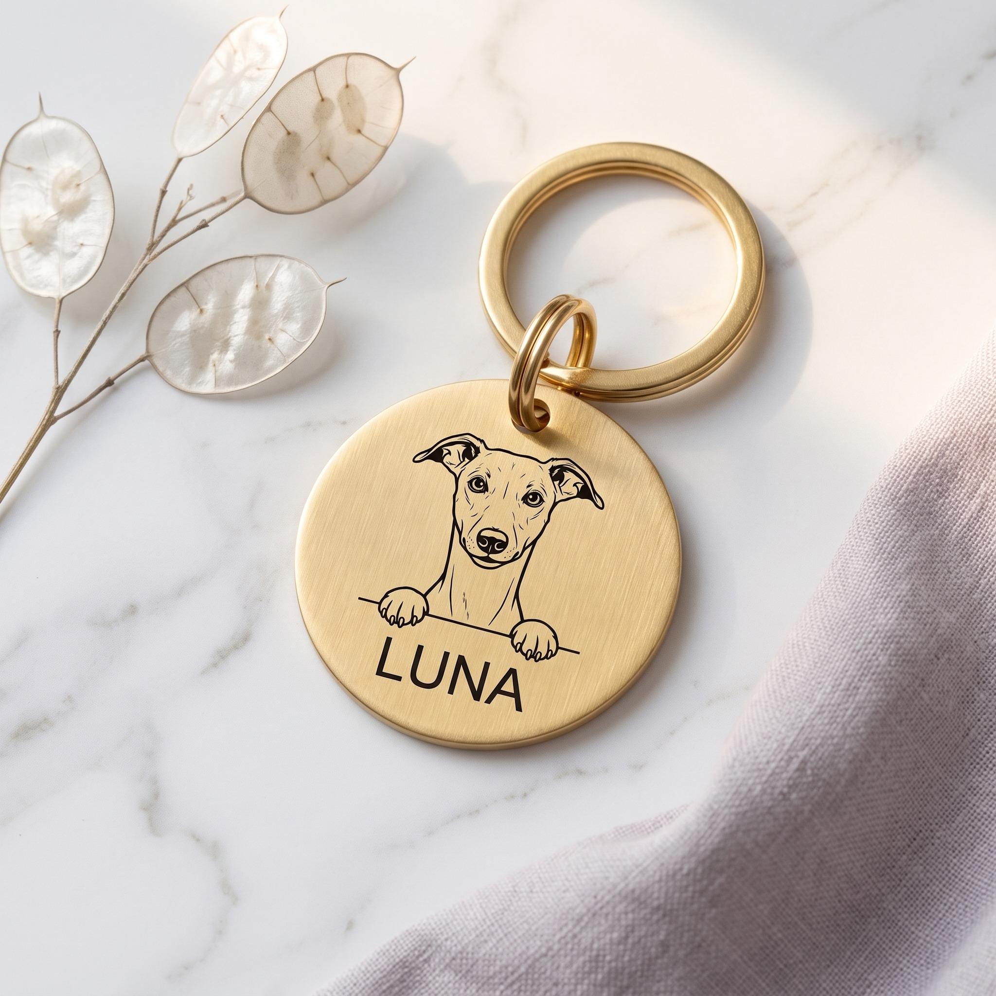 Gold Whippet dog tag engraved with the Whippet design and the name LUNA