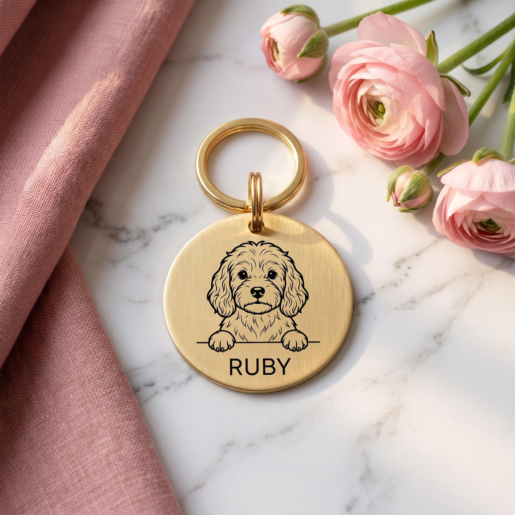 Gold Cavapoo dog tag engraved with the Cavapoo design and the name RUBY