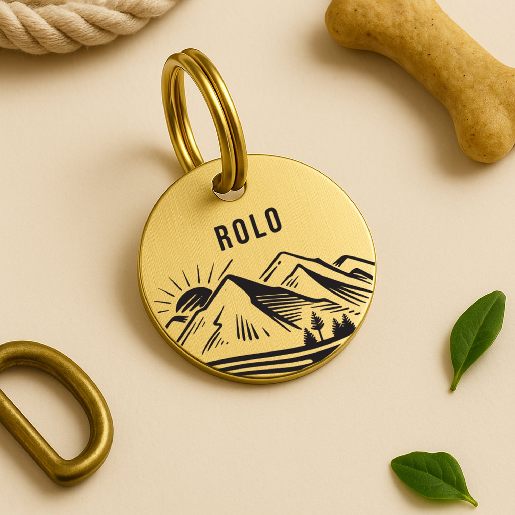 Personalised Dog Name Tag with Engraved Mountain Sunset Design in Gold-Coloured Brass The Stately Hound