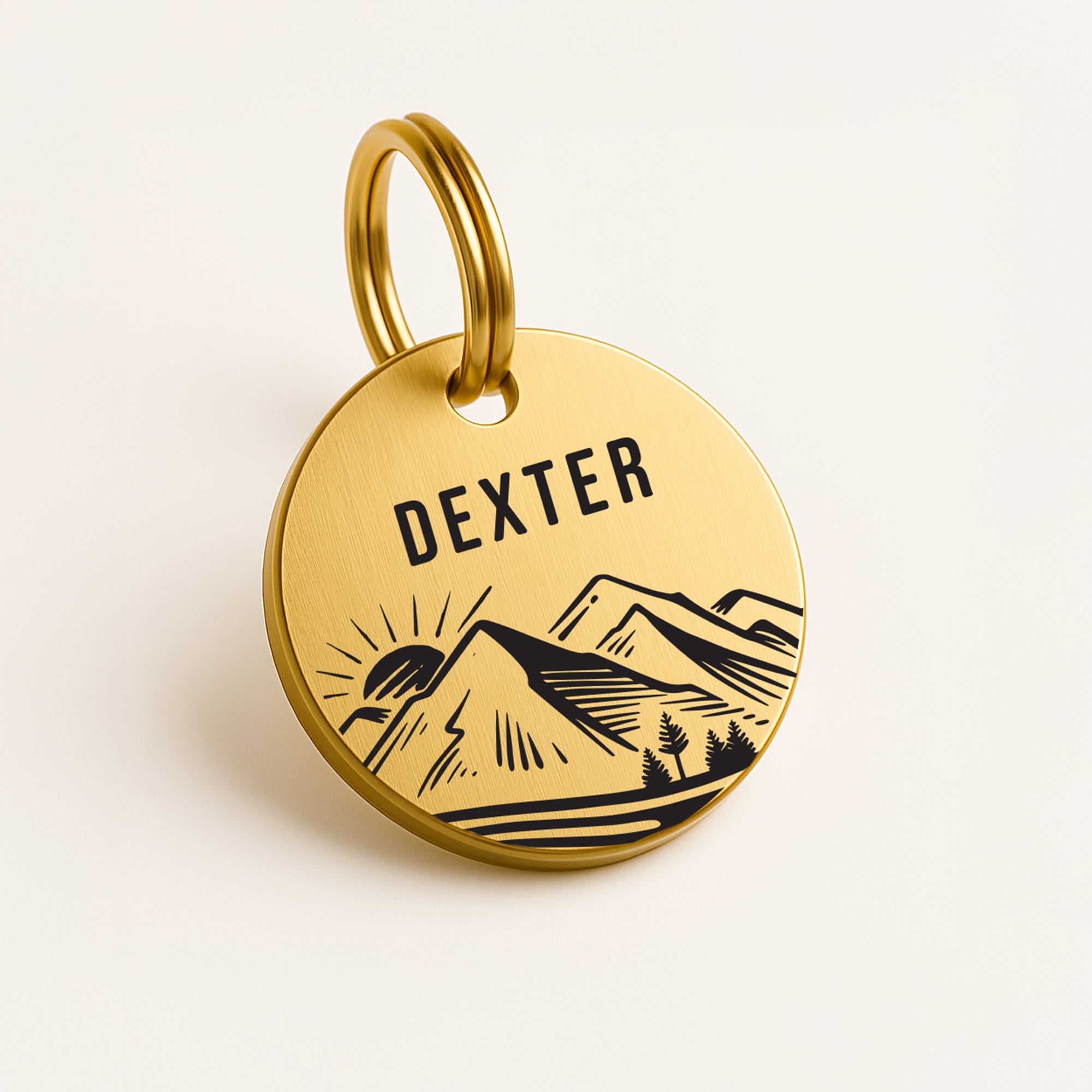Personalised Dog Name Tag with Engraved Mountain Sunset Design in Gold-Coloured Brass The Stately Hound