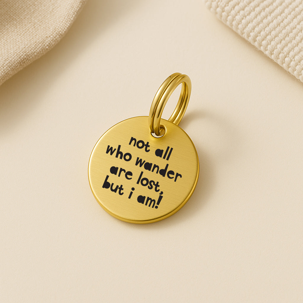 Personalised Gold Brass Dog ID Tag, inscribed with 'Not All Who Wander Are Lost, But I Am!