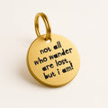 Personalised Gold Brass Dog ID Tag, inscribed with 'Not All Who Wander Are Lost, But I Am!