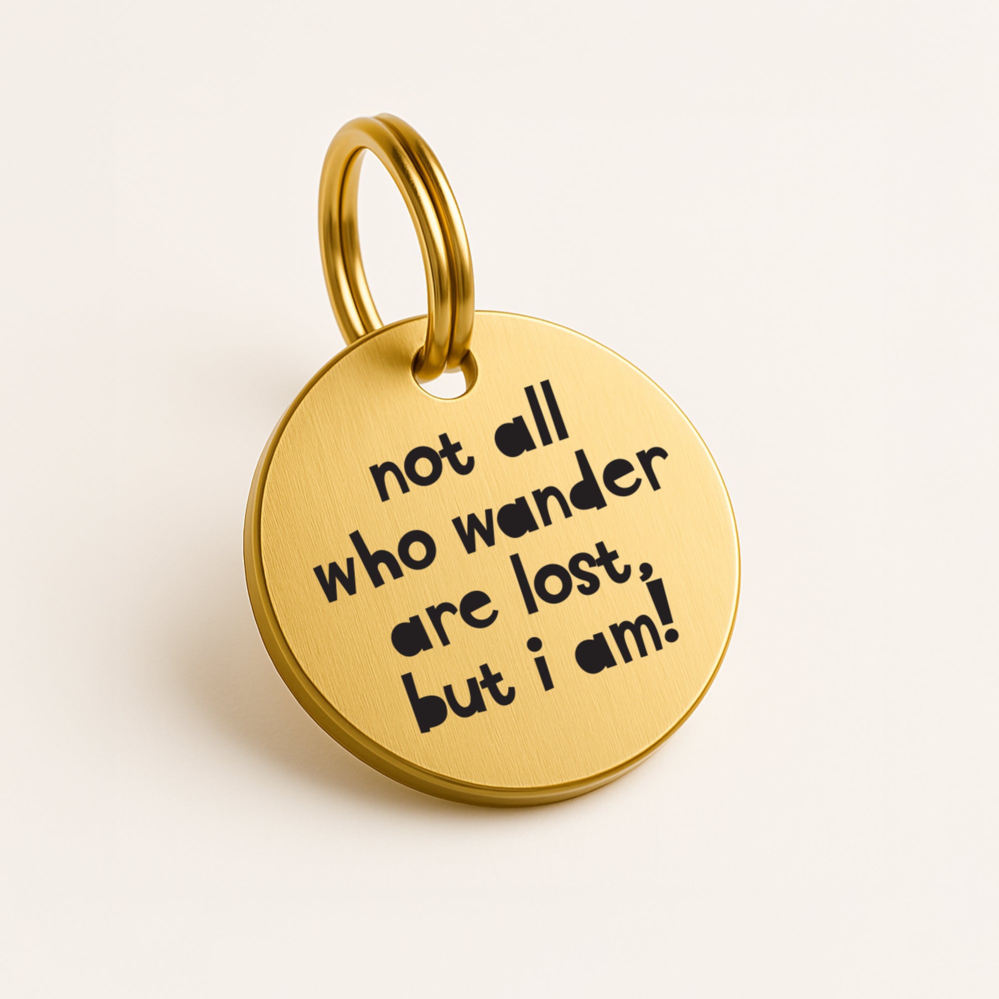Personalised Gold Brass Dog ID Tag, inscribed with 'Not All Who Wander Are Lost, But I Am!