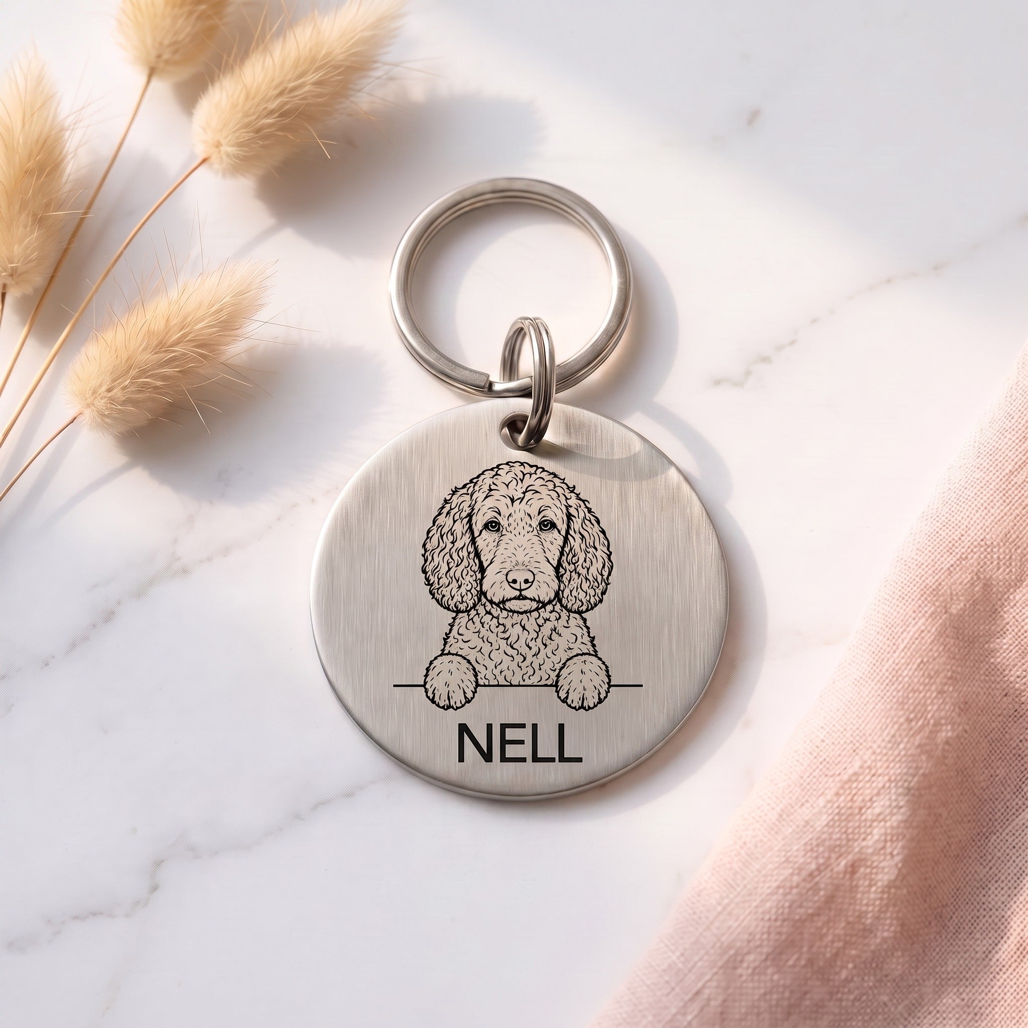 Silver personalised Sproodle dog tag in brushed stainless steel