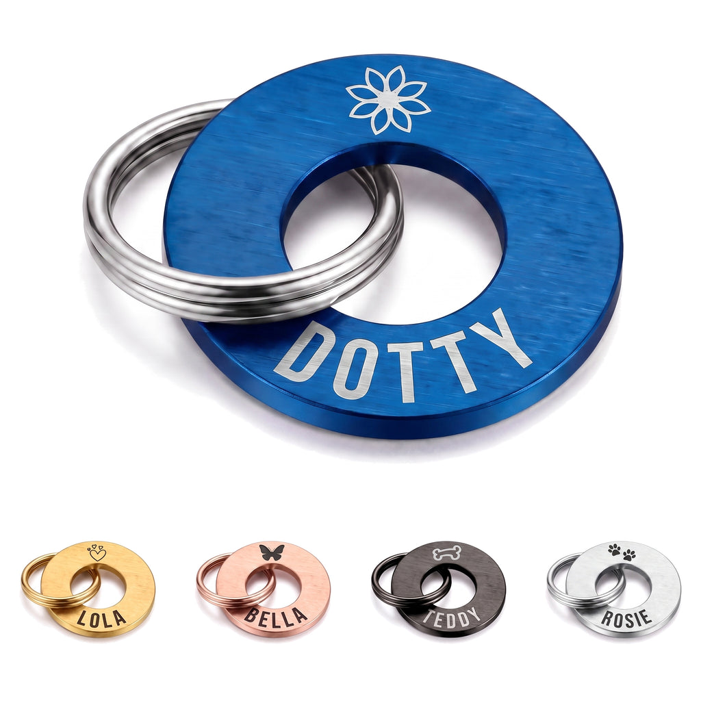 Personalised blue washer dog tag engraved with a name and symbol, silver split ring fitted