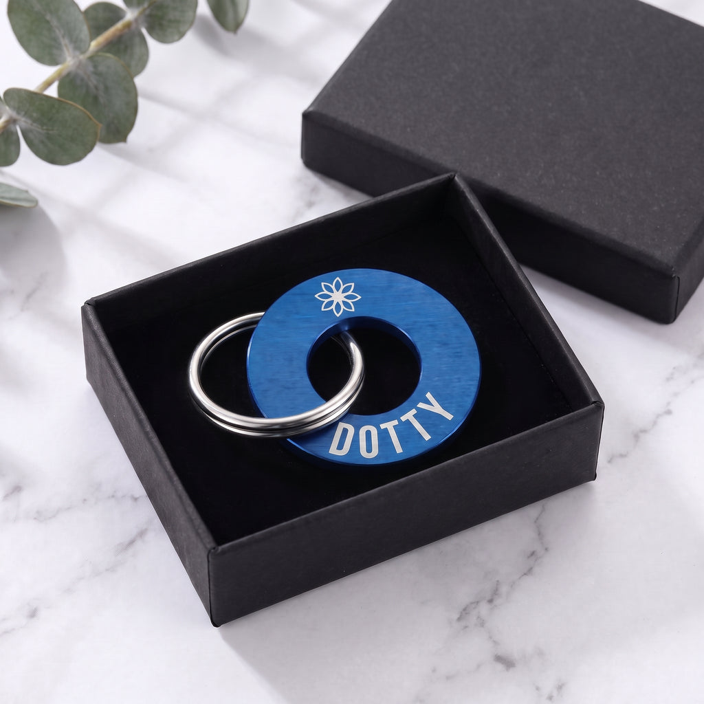 Blue washer dog tag in its matte black gift box
