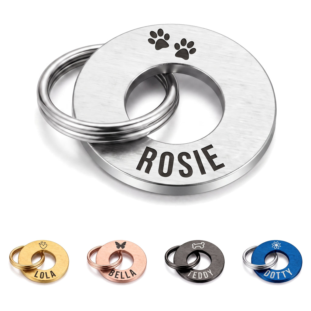 Personalised silver washer dog tag engraved with a name and symbol, split ring fitted
